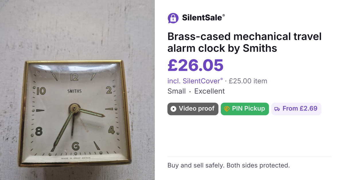 Brass-cased mechanical travel alarm clock by Smiths