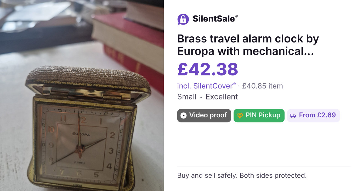 Brass travel alarm clock by Europa with mechanical jeweled movement