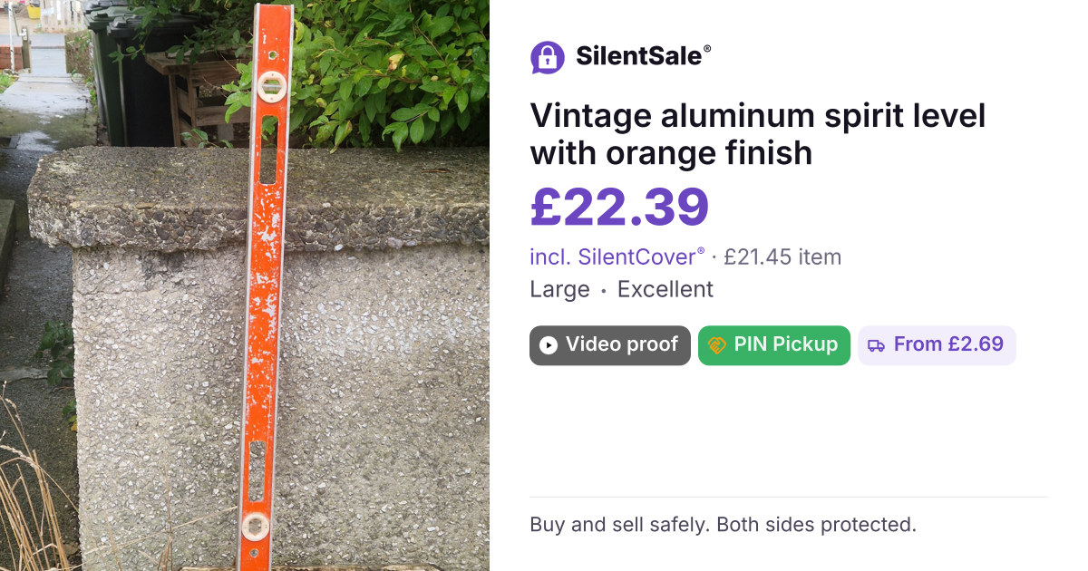 Vintage aluminum spirit level with orange finish