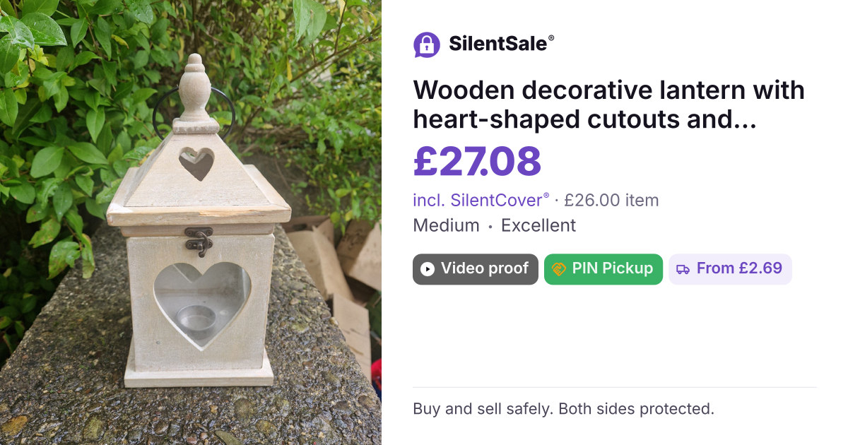 Wooden decorative lantern with heart-shaped cutouts and glass insert